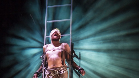 Prometheus chained to a ladder